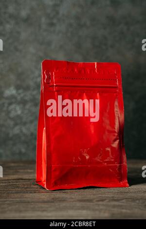 red blank standing pouch mockup on black background Stock Photo