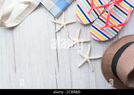 flat composition of summer beach accessories on table. Stock Photo