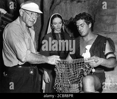 CECIL B. DeMILLE on set candid directing OLIVE DEERING and VICTOR MATURE during filming of  SAMSON AND DELILAH 1949 director CECIL B. DeMILLE Paramount Pictures Stock Photo