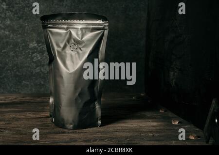 blank black standing pouch on a dark background Stock Photo