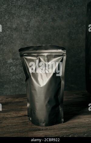 blank black standing pouch on a dark background Stock Photo