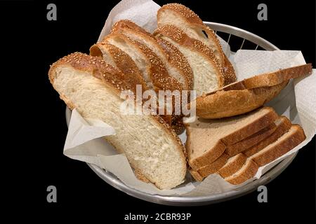 Slices of loaf and bread in a bread box on a black background Stock Photo