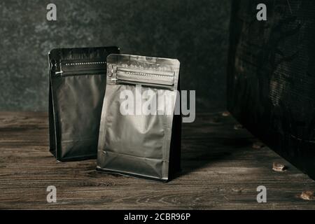 blank black standing pouch on a dark background Stock Photo