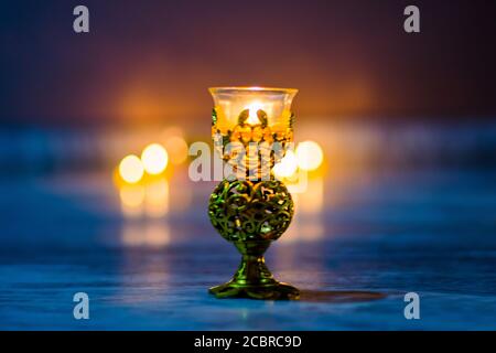 Happy Diwali - Colorful clay diya lamps lit during diwali celebration Stock Photo