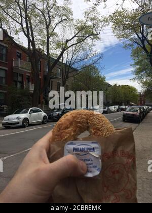 St Viateur bagel and Philadelphia cheese package with Montreal city background. Montreal, Quebec /Canada Stock Photo