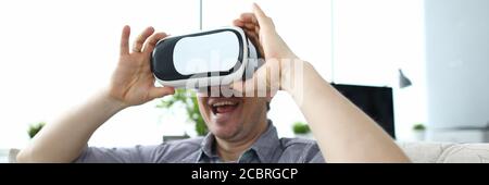 Guy using VR at home Stock Photo