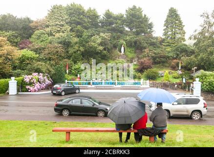 Ballinspittle, Cork, Ireland. 15th August, 2020. On the feast of Assumption of Mary a few people braved the bad weather to hear the Rosary at the grotto in Ballinspittle, Co. Cork, Ireland. - Credit; David Creedon / Alamy Live News Stock Photo