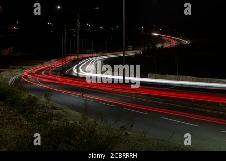Light trails of cars on a busy street. Stock Photo