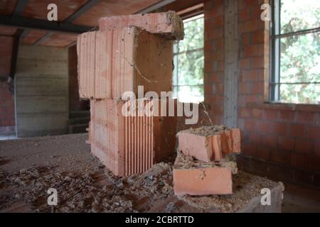red brick in a dark old house under construction Stock Photo