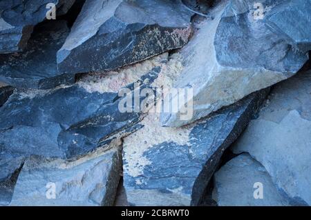 Pile of large stones, preparation for construction. Big gray block, stone background Stock Photo