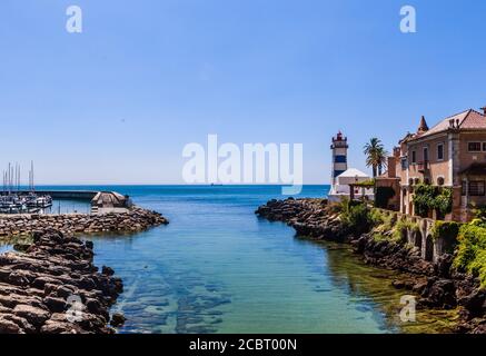Superb view of the inlet along the rocky coastline near the Santa Marta Lighthouse in Cascais, Portugal Stock Photo