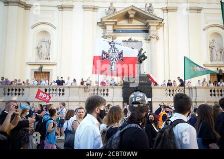 Warsaw, Pl. 15th Aug, 2020. Several hundred people are seen taking part in a march of the ultranaionatlist All Polish Youth (Mlodziez Wszechpolska) in Warsaw, Poland on August 15, 2020. The far-right and ultranationalist youth organisation organized a march on Saturday in light of the 100th anniversary of the Battle of Warsaw, the battle that turned the tide on the Bolshevik invasion of Europe. The All Polish Youth also oppose liberal values and oppose non-binary gender people who they see as a threat to Polish culture. (Photo by Jaap Arriens/Sipa USA) Credit: Sipa USA/Alamy Live News Stock Photo