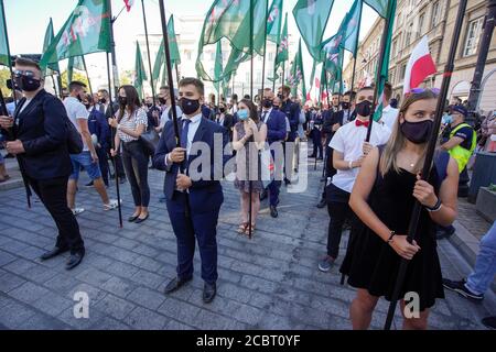 Warsaw, Pl. 15th Aug, 2020. Several hundred people are seen taking part in a march of the ultranaionatlist All Polish Youth (Mlodziez Wszechpolska) in Warsaw, Poland on August 15, 2020. The far-right and ultranationalist youth organisation organized a march on Saturday in light of the 100th anniversary of the Battle of Warsaw, the battle that turned the tide on the Bolshevik invasion of Europe. The All Polish Youth also oppose liberal values and oppose non-binary gender people who they see as a threat to Polish culture. (Photo by Jaap Arriens/Sipa USA) Credit: Sipa USA/Alamy Live News Stock Photo