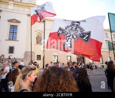 Warsaw, Pl. 15th Aug, 2020. Several hundred people are seen taking part in a march of the ultranaionatlist All Polish Youth (Mlodziez Wszechpolska) in Warsaw, Poland on August 15, 2020. The far-right and ultranationalist youth organisation organized a march on Saturday in light of the 100th anniversary of the Battle of Warsaw, the battle that turned the tide on the Bolshevik invasion of Europe. The All Polish Youth also oppose liberal values and oppose non-binary gender people who they see as a threat to Polish culture. (Photo by Jaap Arriens/Sipa USA) Credit: Sipa USA/Alamy Live News Stock Photo