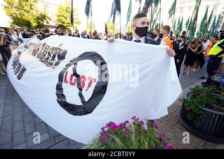 Warsaw, Pl. 15th Aug, 2020. Several hundred people are seen taking part in a march of the ultranaionatlist All Polish Youth (Mlodziez Wszechpolska) in Warsaw, Poland on August 15, 2020. The far-right and ultranationalist youth organisation organized a march on Saturday in light of the 100th anniversary of the Battle of Warsaw, the battle that turned the tide on the Bolshevik invasion of Europe. The All Polish Youth also oppose liberal values and oppose non-binary gender people who they see as a threat to Polish culture. (Photo by Jaap Arriens/Sipa USA) Credit: Sipa USA/Alamy Live News Stock Photo