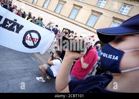 Warsaw, Pl. 15th Aug, 2020. Several hundred people are seen taking part in a march of the ultranaionatlist All Polish Youth (Mlodziez Wszechpolska) in Warsaw, Poland on August 15, 2020. The far-right and ultranationalist youth organisation organized a march on Saturday in light of the 100th anniversary of the Battle of Warsaw, the battle that turned the tide on the Bolshevik invasion of Europe. The All Polish Youth also oppose liberal values and oppose non-binary gender people who they see as a threat to Polish culture. (Photo by Jaap Arriens/Sipa USA) Credit: Sipa USA/Alamy Live News Stock Photo