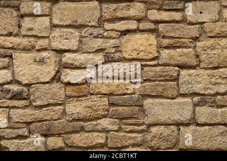 Gray stone wall made of natural stone Stock Photo