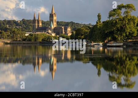 Truro Cathedral reflected in Truro River.  The image captured from Boscawen Park on a morning in early August. Stock Photo