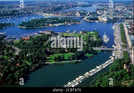 Aerial view of lush green islands and docks of Stockholm with lines of yachts  during summer regatta Stock Photo