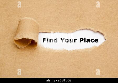 Concept with printed text Find Your Place appearing behind ripped brown paper. Stock Photo
