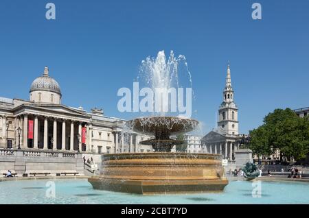 Fountain, National Gallery and St Martin-in-the-Fields Church, Trafalgar Square, City of Westminster, Greater London, England, United Kingdom Stock Photo