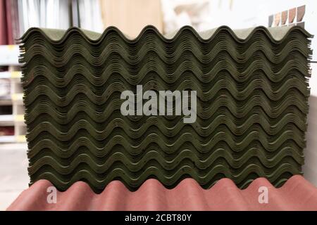 Roof green slate tiles in warehouse store Stock Photo