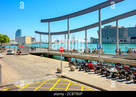 View of Port Vell. People strolling on bridge Rambla del Mar. Barcelona, Spain, Catalonia Stock Photo