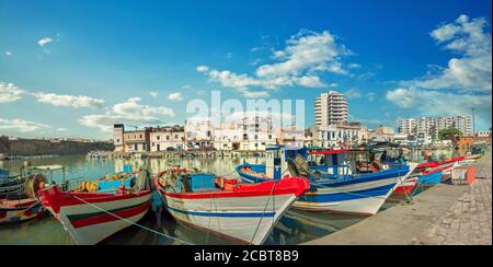 Panoramic view of wharf with colorful fishing boats at old port in Bizerte. Tunisia, North Africa Stock Photo