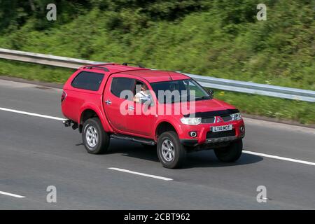 Mitsubishi L200Barb LB DCB Di-D4X4 A driving on the M6 motorway near Preston in Lancashire, UK. Stock Photo