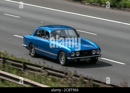 MBW421N 1975 Bristol 411 Series 4 (Blmc) Blue Car driving on the M6 motorway near Preston in Lancashire, UK. Stock Photo