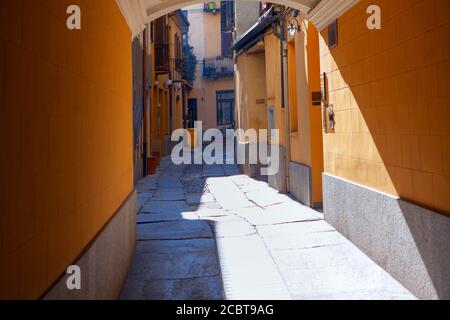 arched narrow street in Italy . Pavement in old italian town Stock Photo