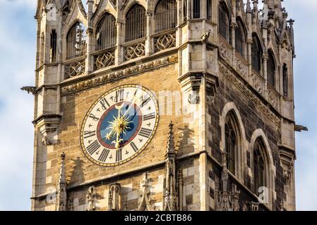 Clock Tower of New Town Hall or Rathaus on Marienplatz square closeup, Munich, Bavaria, Germany. It is old landmark of Munich. Detail of ornate Gothic Stock Photo