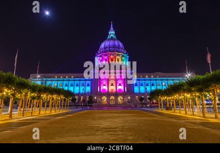 San Francisco City Hall lights up rainbow colors to celebrate the LGBT pride month in June, California, United States. Stock Photo