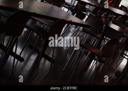 low angle view of room full of chairs and tables Stock Photo