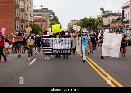 Washington, DC, USA. 15th Aug, 2020. Pictured: Protesters at the Defund the Police March walk through Columbia Heights, shutting down the street in the process. Credit: Allison C Bailey/Alamy Credit: Allison Bailey/Alamy Live News