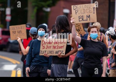 Washington, DC, USA. 15th Aug, 2020. Pictured: Protesters carry signs during the Defund the Police March through the Columbia Heights neighborhood. Credit: Allison C Bailey/Alamy Stock Photo