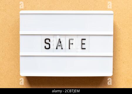 Lightbox with word safe on wood background Stock Photo