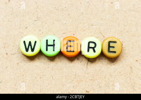 Round color bead with black letter in word where on wood background Stock Photo