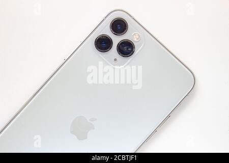 Calgary, Alberta, Canada. Aug 15, 2020. A person holding an iPhone 11 Pro Max on the back side cameras Stock Photo