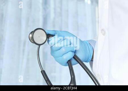 Close up of doctor hand holding stethoscope. Stock Photo