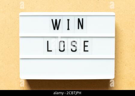 Lightbox with word win lose on wood background Stock Photo