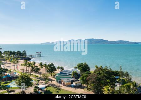 View of Magnetic Island and the jetty on The Strand beach, Townsville, Australia from high view point Stock Photo