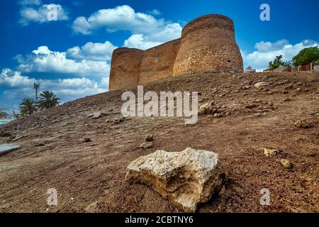 Tarout Castle, Qatif, Saudi Arabia in blue sky with clouds background. Stock Photo