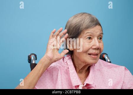 Senior adult woman hearing loss , Hard of hearing Stock Photo
