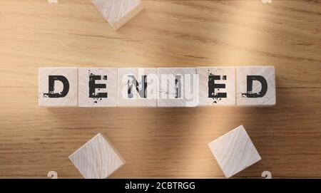 denied word written on wood block Stock Photo