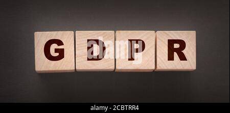 GDPR Word Written In Wooden Cubes on black Stock Photo
