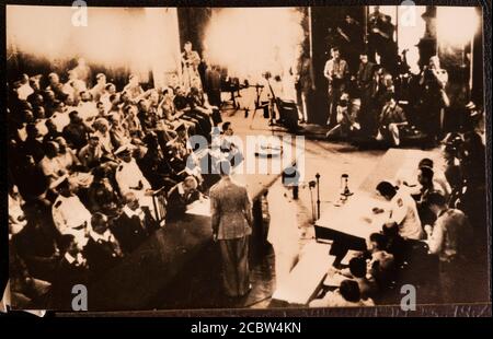 Japanese Surrender to Lord Louis Mountbatten in Singapore 12 September 1945 These original photographic prints were bought home from the far east by the photographers father in the bottom of a tool box after the war. They are in a family album and copied by this photographer SINGAPORE. 1945-09-12. ADMIRAL LORD LOUIS MOUNTBATTEN SUPREME ALLIED COMMANDER, SOUTH EAST ASIA COMMAND (SEAC), ACCEPTED THE SURRENDER OF JAPANESE FORCES IN THE AREA DURING A SURRENDER CEREMONY HELD IN THE COUNCIL CHAMBER, MUNICIPAL BUILDING, SINGAPORE. IN THE ABSENCE OF FIELD MARSHAL COUNT TERAUCHI, JAPANESE COMMANDER IN Stock Photo