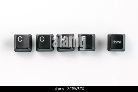 Computer keyboard keys spelling Come Home, isolated on white background Stock Photo