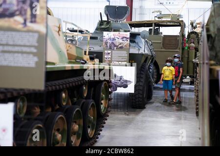 New York, USA. 15th Aug, 2020. Kids look around in the Museum of American Armor on Long Island of New York State, the United States, Aug. 15, 2020. TO GO WITH 'Feature: American museum helps raise U.S. public awareness about China's history in WWII' Credit: Wang Ying/Xinhua/Alamy Live News Stock Photo