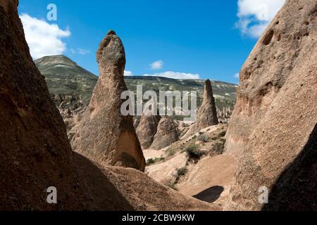 A view showing volcanic rock formations known as fairy chimneys at the Devrent Valley in the Cappadocia region of Turkey. Stock Photo